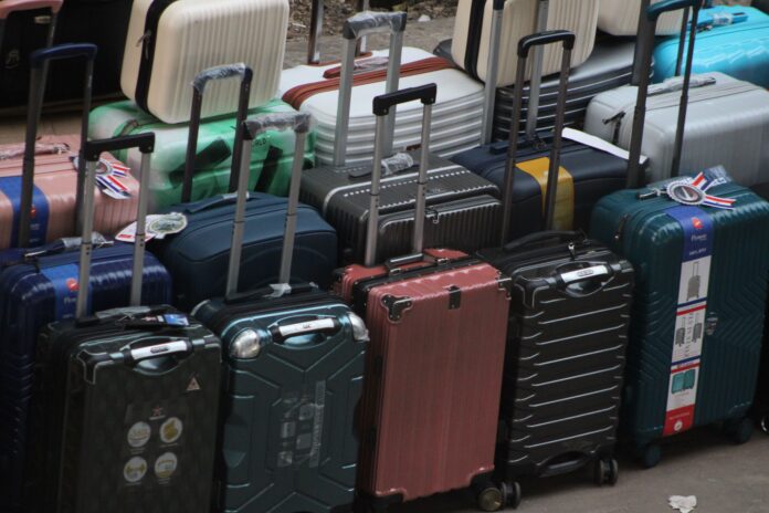 pexels-photo-34629933 A variety of modern hard shell and soft shell suitcases arranged together