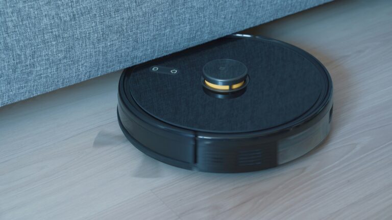 Robot vacuum cleaner in a bright home, representing the best robot vacuum deals covered in this UK buying guide