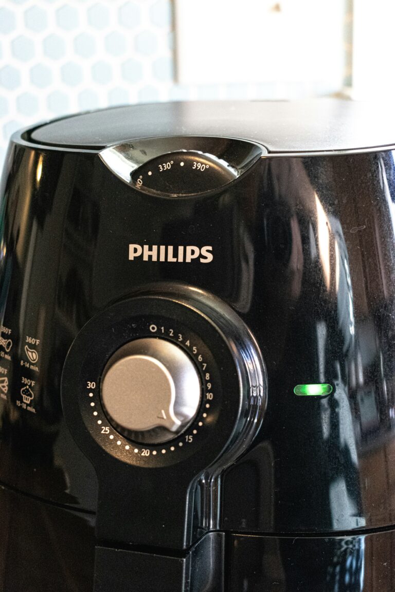 Close-up of a black air fryer on a kitchen counter